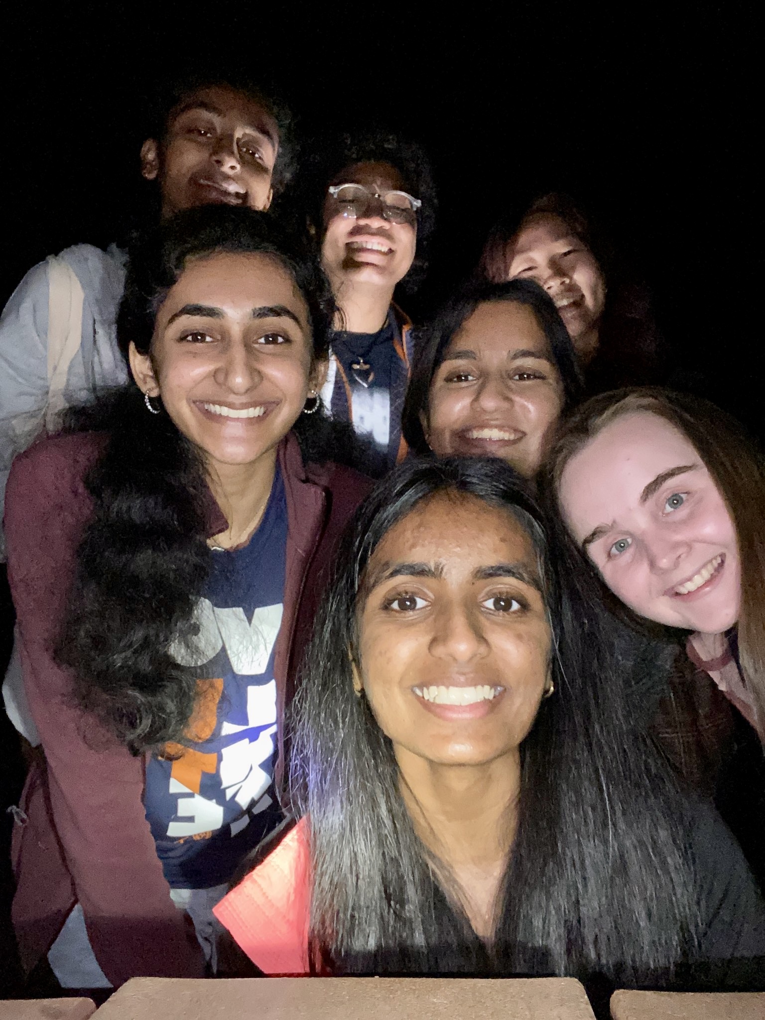 SCC Members take a selfie outdoors at night